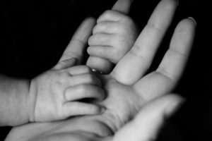 Mother and baby, hand and hand