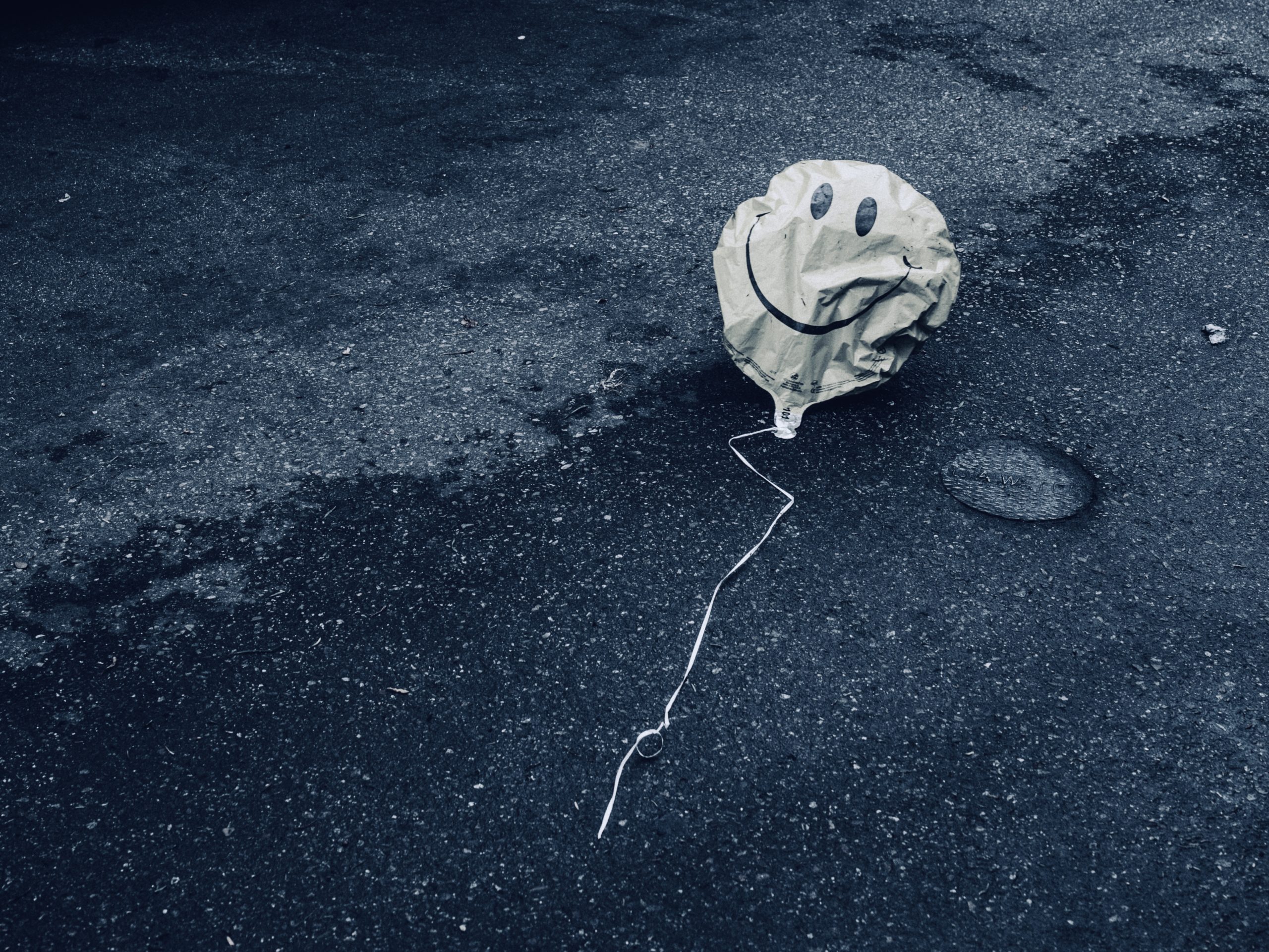 Deflated smiley balloon